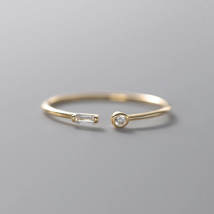 Adjustable ring plated in 14k gold and 925 sterling silver adorned with zirconia