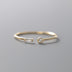 Adjustable ring plated in 14k gold and 925 sterling silver adorned with zirconia