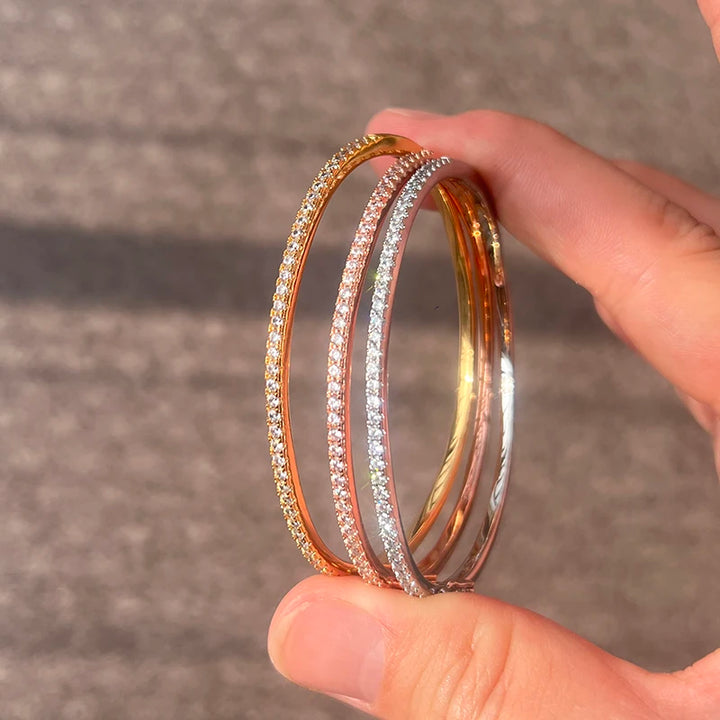 Bracelet in sterling silver, plated in 14k gold and rose gold with zirconias